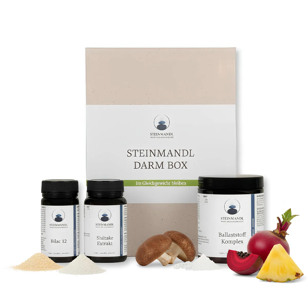 Die Darm Box enthält drei Behältnisse mit pulverförmigen Inhaltsstoffen, einem Pilz, einer Ananasscheibe und einem Granatapfelsegment, die vor der charakteristischen Darm Box-Verpackung angeordnet sind.